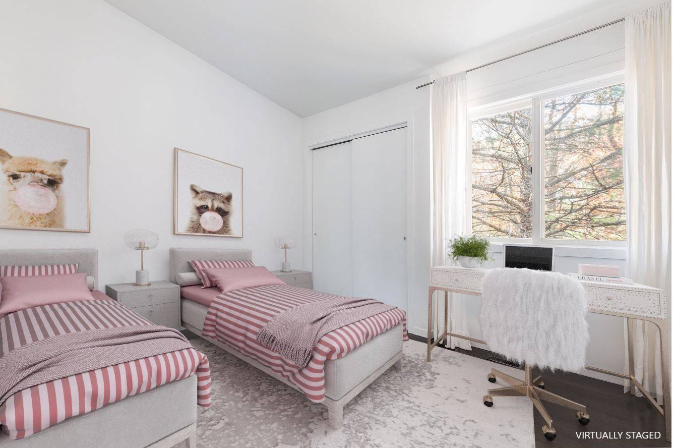 132 Springy Banks Road East Hampton, NY 11937 - Photo 22 of 37 a bedroom with two beds and a large window