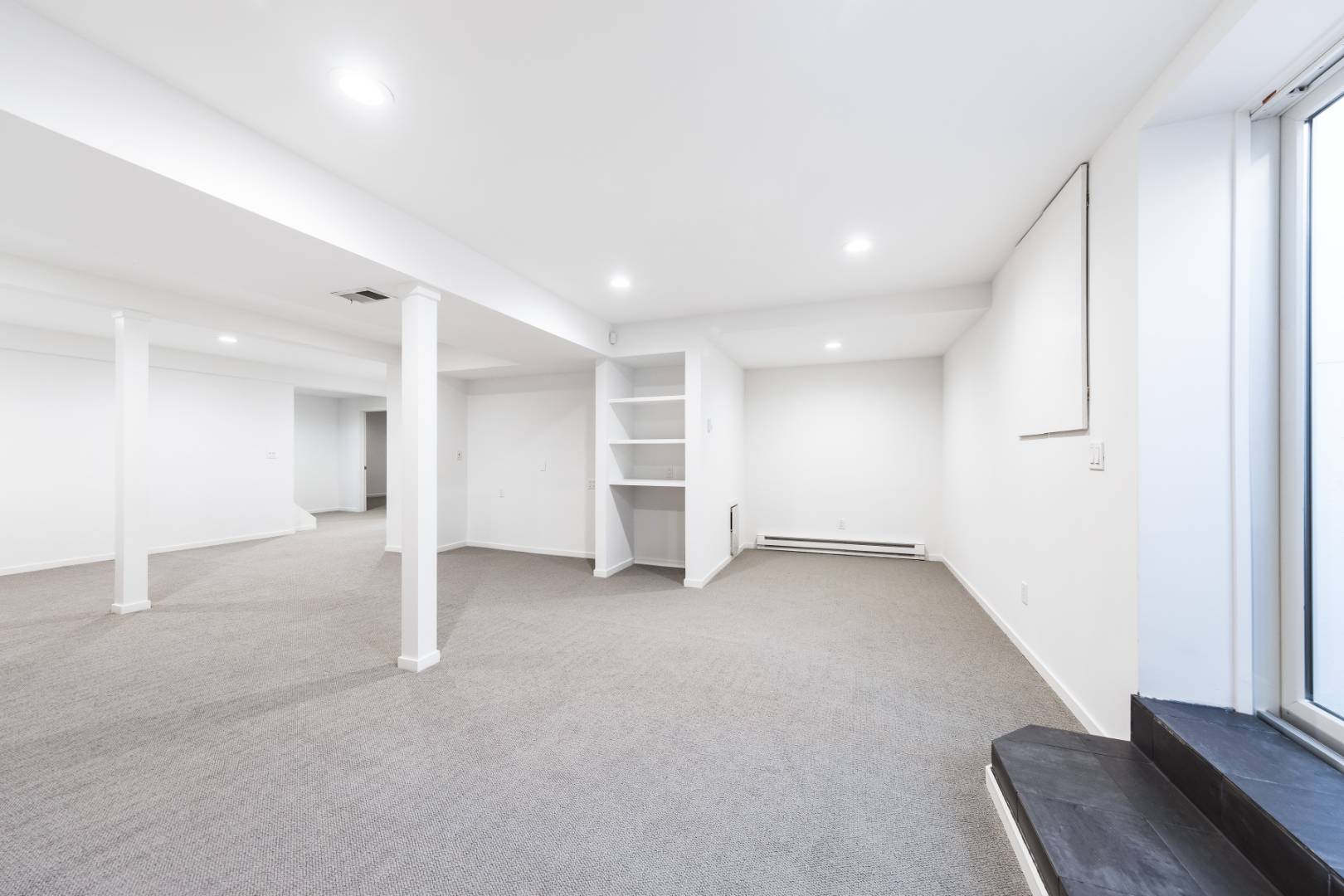 132 Springy Banks Road East Hampton, NY 11937 - Photo 29 of 37 an empty room with a cabinet and mirrors