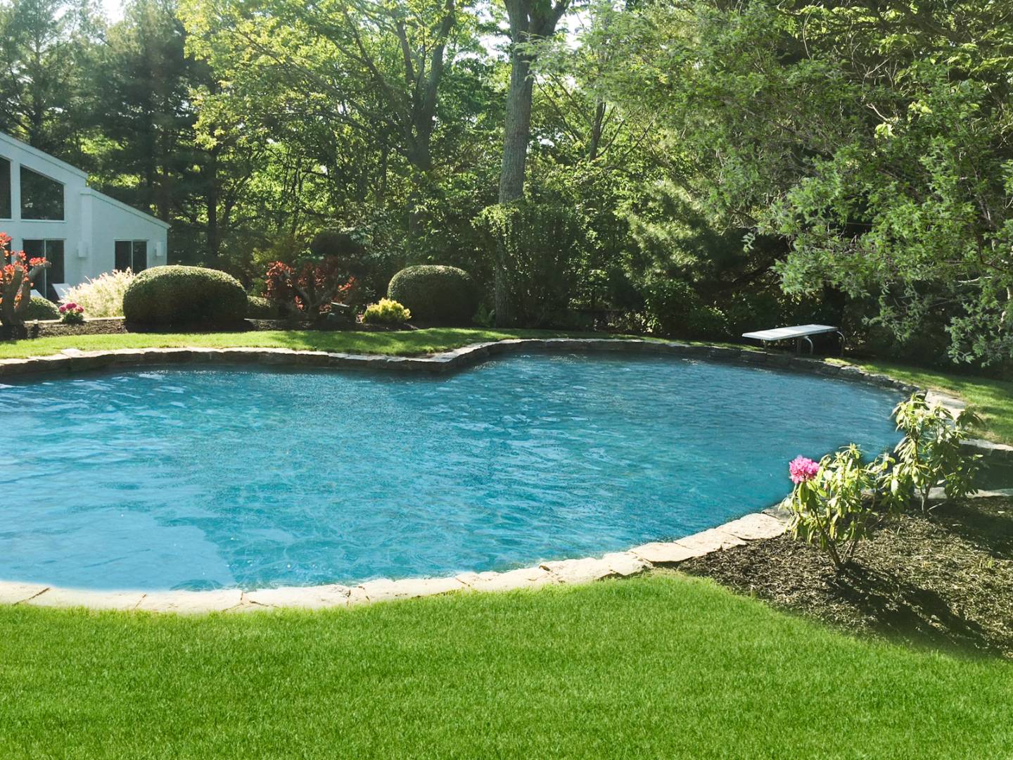 132 Springy Banks Road East Hampton, NY 11937 - Photo 32 of 37 a view of a garden with a fountain