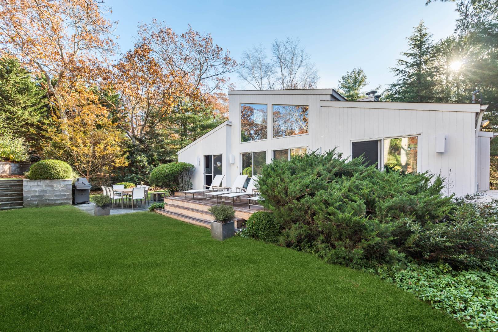 132 Springy Banks Road East Hampton, NY 11937 - Photo 6 of 37 a front view of a house with a garden