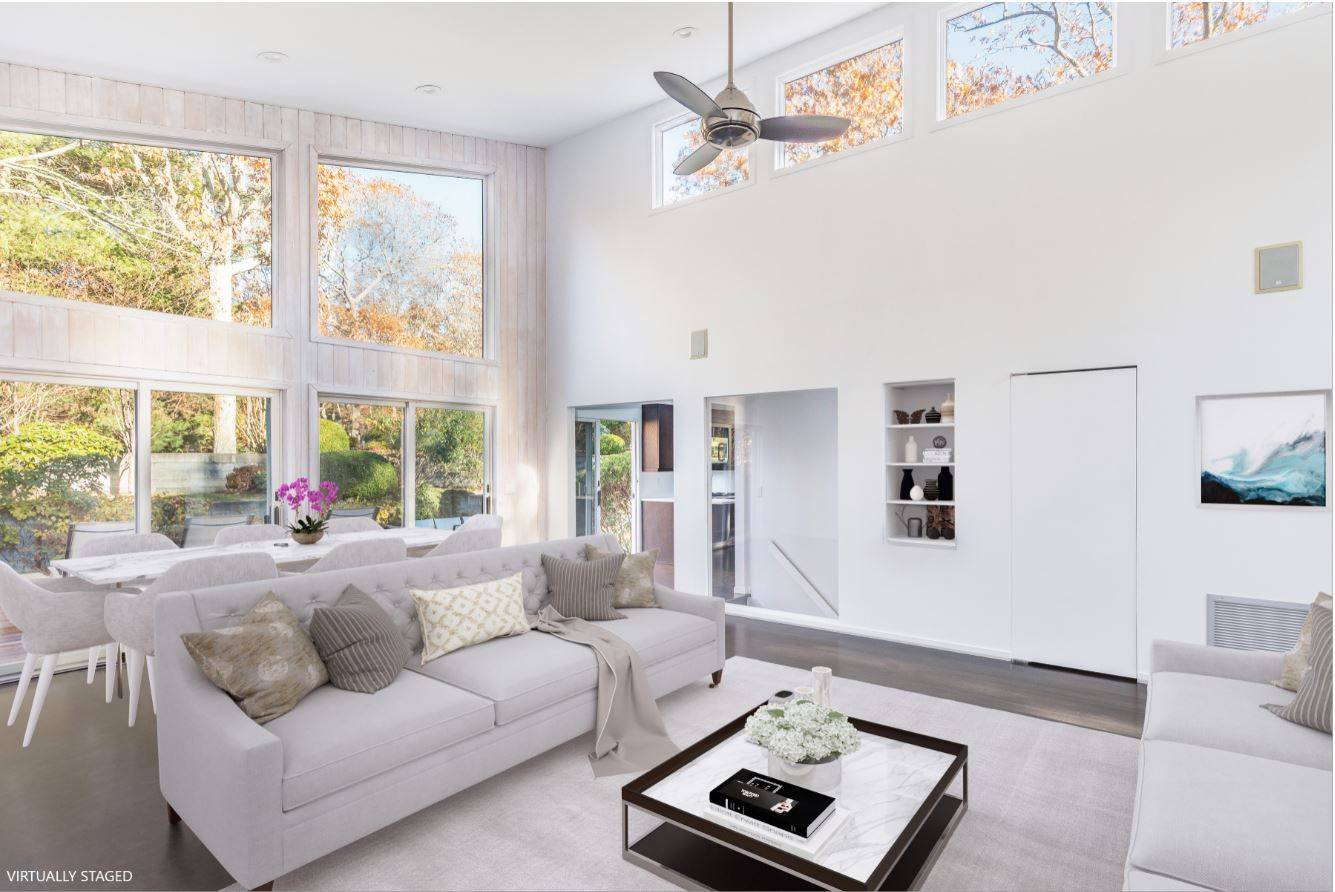 132 Springy Banks Road East Hampton, NY 11937 - Photo 10 of 37 a living room with furniture and a large window