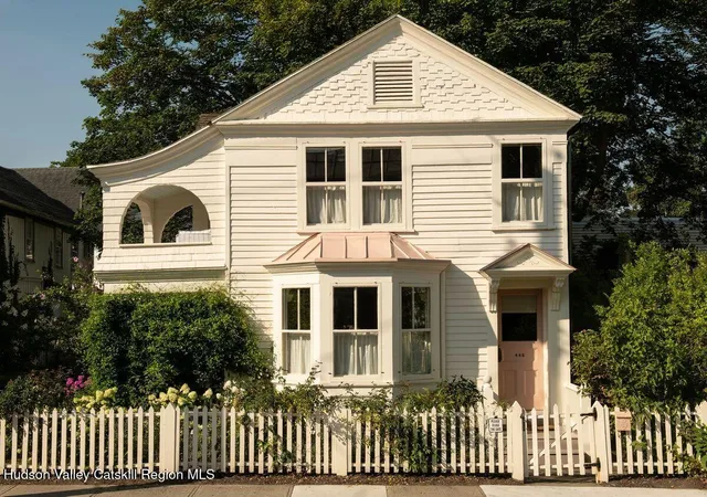 a front view of a house with a porch