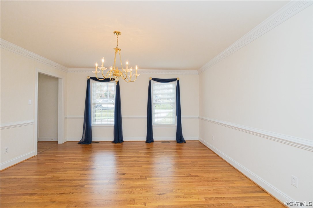 13003 Chipstead Road Chester, VA 23831 - Photo 34 of 38 a view of an empty room with window and wooden floor