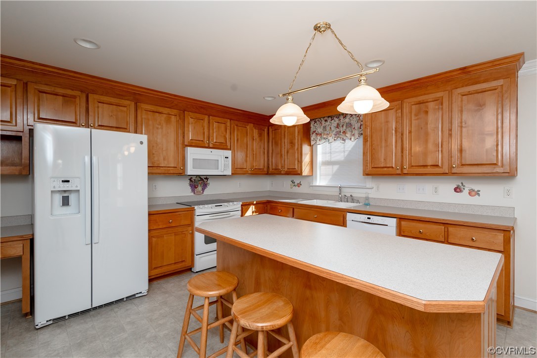 13003 Chipstead Road Chester, VA 23831 - Photo 4 of 38 a kitchen with stainless steel appliances granite countertop a refrigerator a sink dishwasher a stove a dining table and chairs with wooden floor