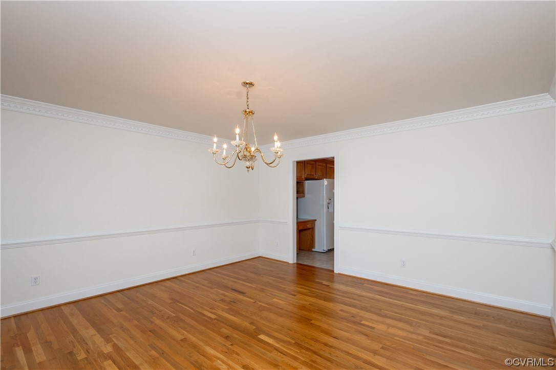 13003 Chipstead Road Chester, VA 23831 - Photo 9 of 38 a view of empty room with wooden floor and fan