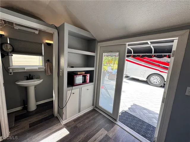 a utility room with closet dryer and washer