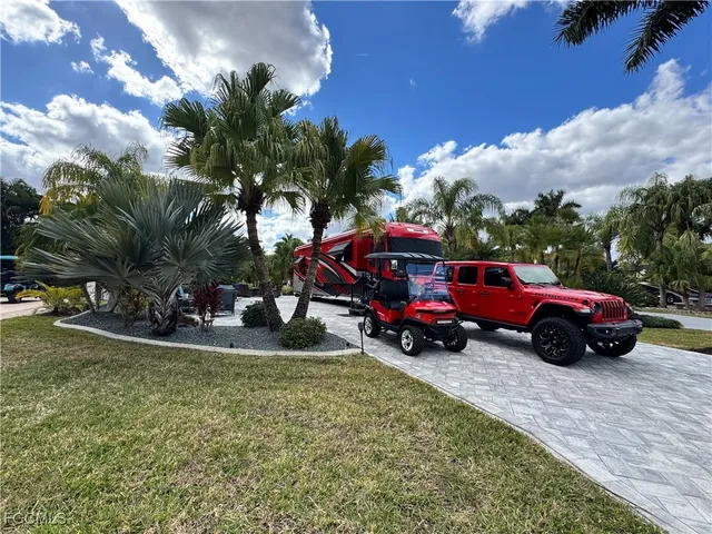 a view of a car is parked in a yard