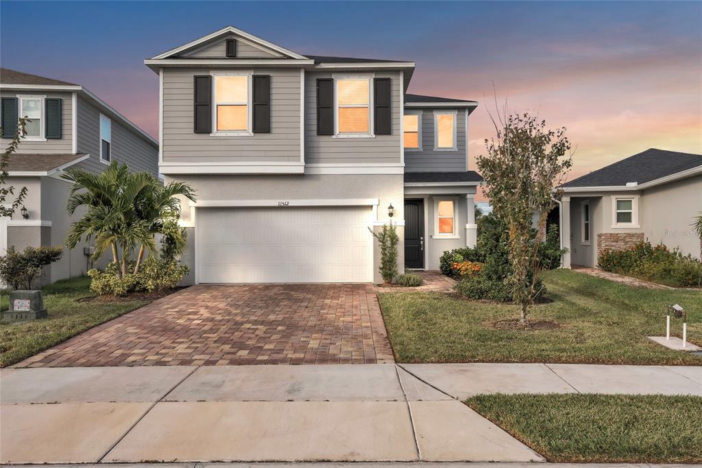 11512 Gallatin Trail Parrish, FL 34219 - Photo 1 of 39 a front view of a house with a yard and garage