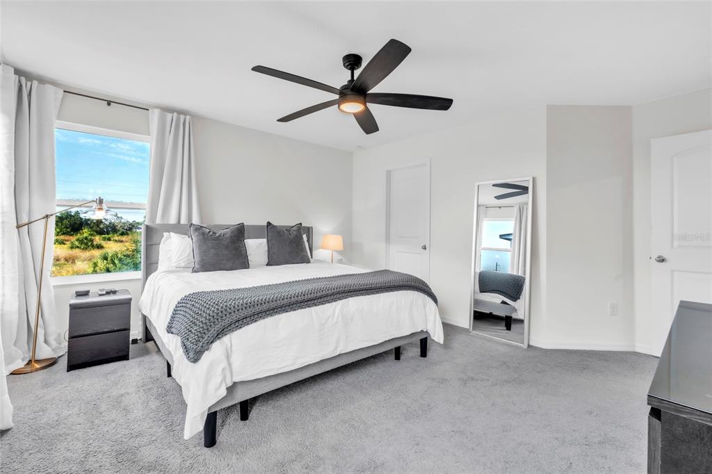 11512 Gallatin Trail Parrish, FL 34219 - Photo 15 of 39 a bedroom with a bed and window