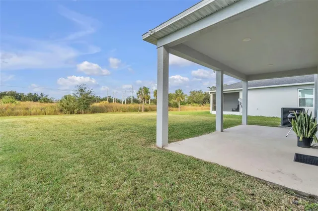 a view of a garden with an ocean view