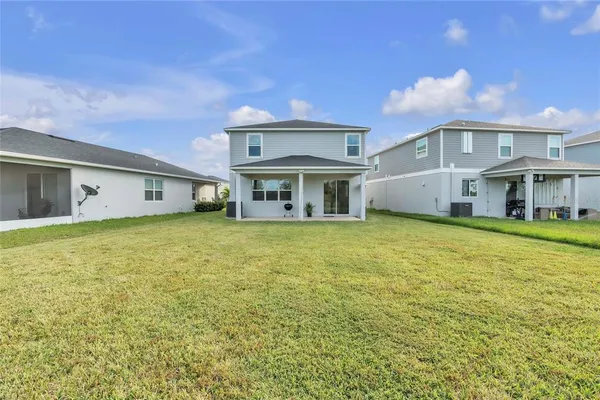 a front view of house with yard and entertaining space