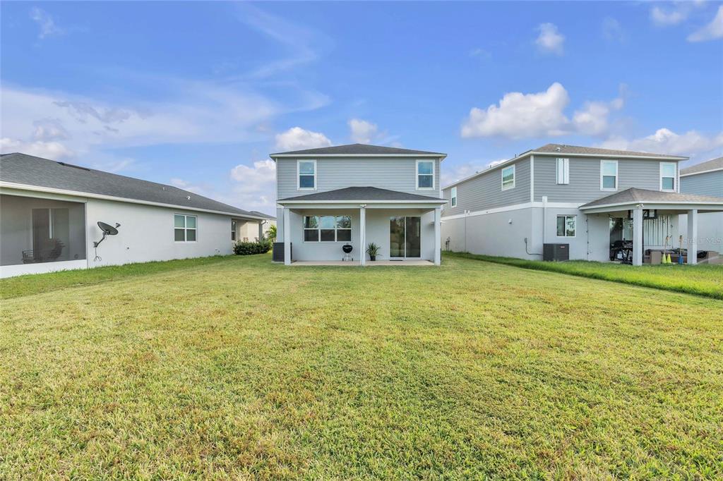 11512 Gallatin Trail Parrish, FL 34219 - Photo 31 of 39 a front view of house with yard and entertaining space