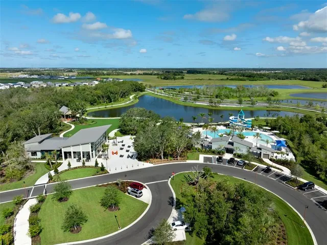 a view of a swimming pool with a yard