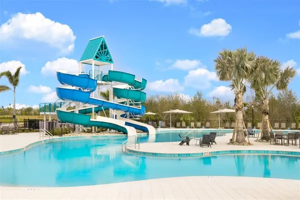 a view of a swimming pool with a patio