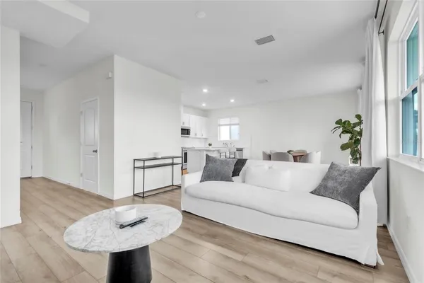 a living room with furniture and a table