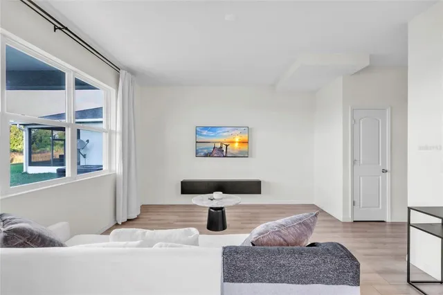 a living room with furniture and a window