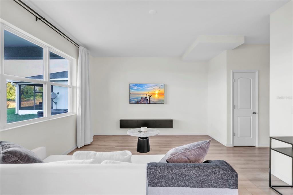 11512 Gallatin Trail Parrish, FL 34219 - Photo 10 of 39 a living room with furniture and a window