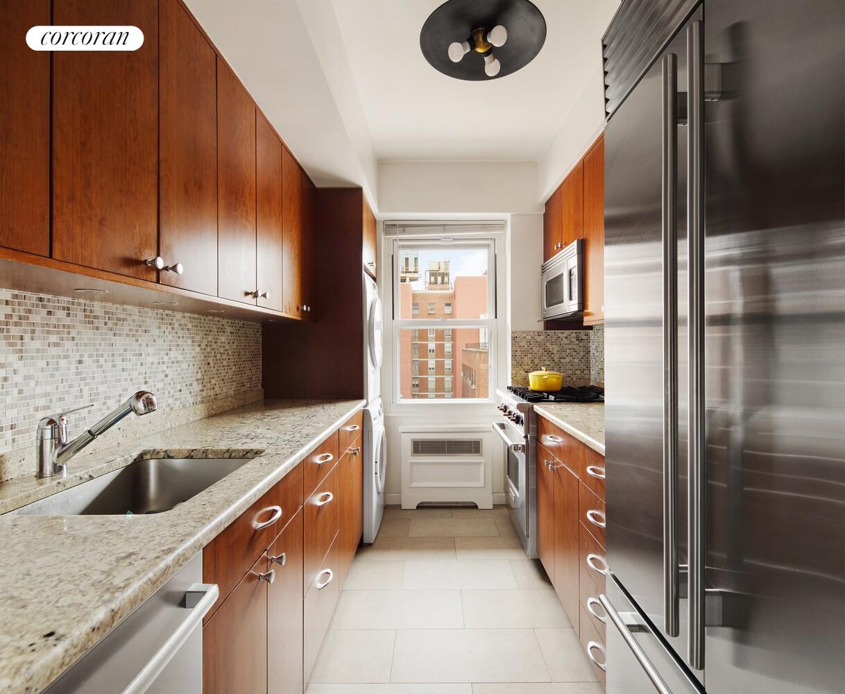136 East 76th Street, Unit 15B Manhattan, NY 10021 - Photo 4 of 12 a kitchen with a sink stove and refrigerator