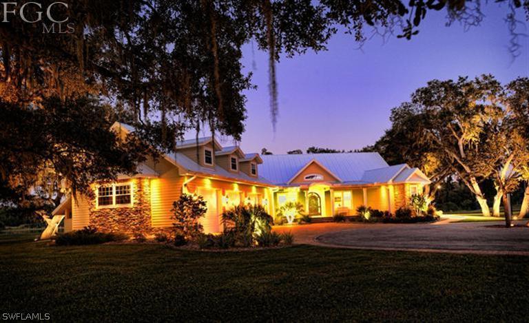 19010 Persimmon Ridge Road Alva, FL 33920 - Photo 1 of 24 a view of an outdoor space with swimming pool