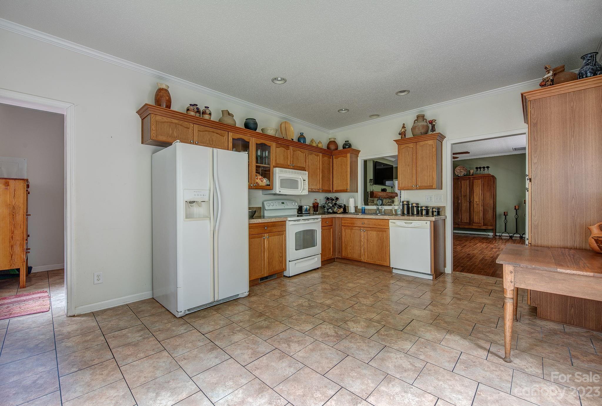 146 Flowers Road Gastonia, NC 28056 - Photo 11 of 11 a kitchen with stainless steel appliances a refrigerator sink and cabinets