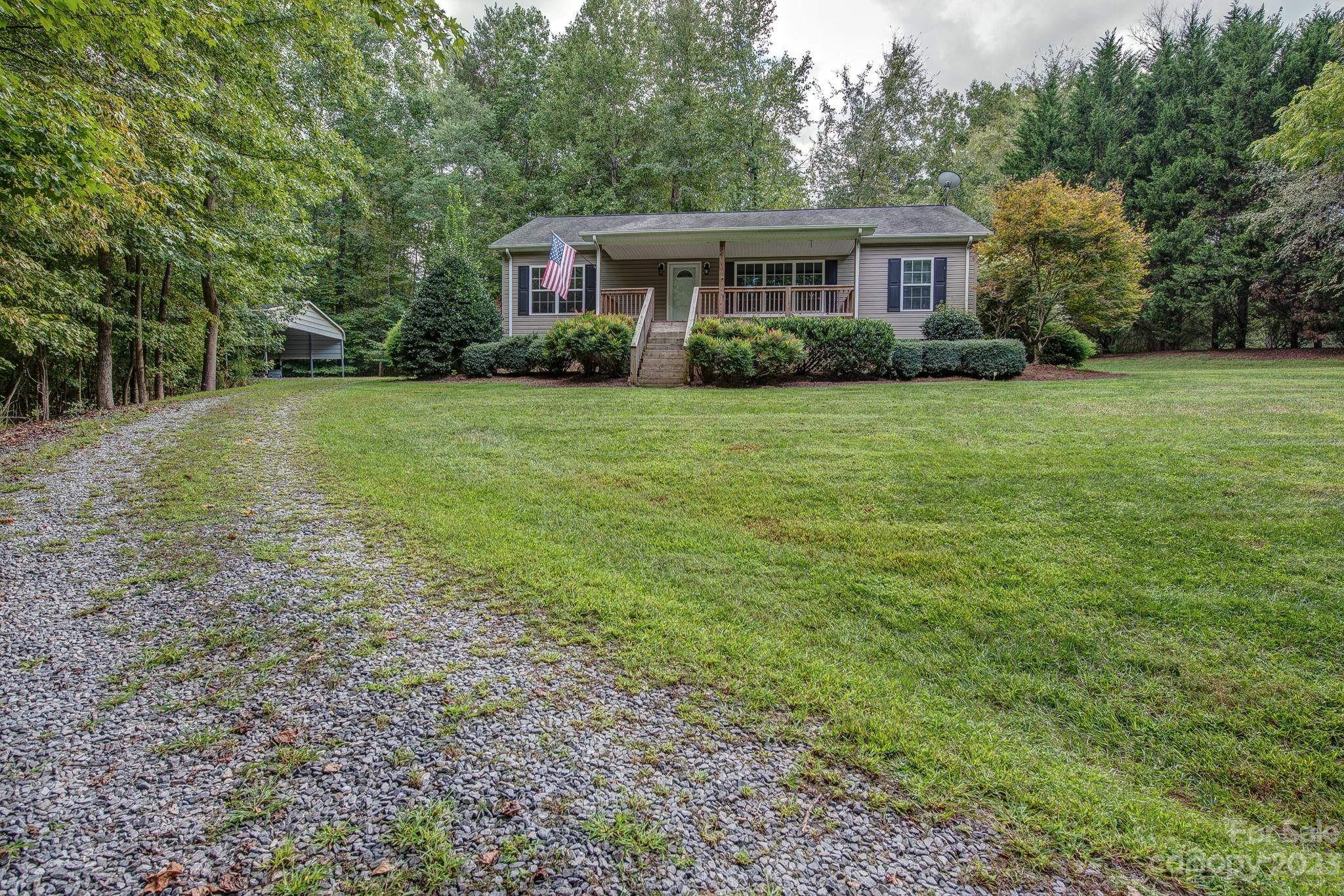 146 Flowers Road Gastonia, NC 28056 - Photo 2 of 11 a view of a house with yard and green space