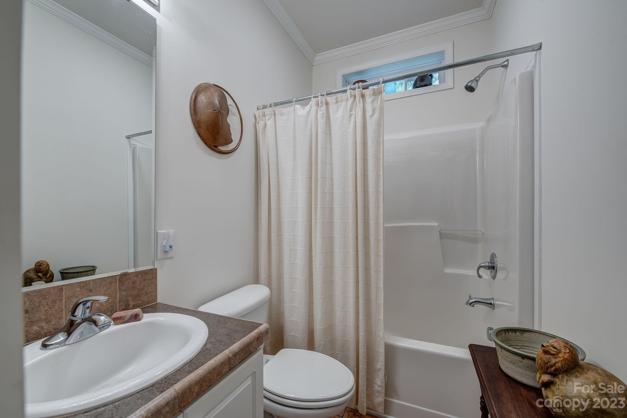 146 Flowers Road Gastonia, NC 28056 - Photo 7 of 11 a bathroom with a sink toilet and shower