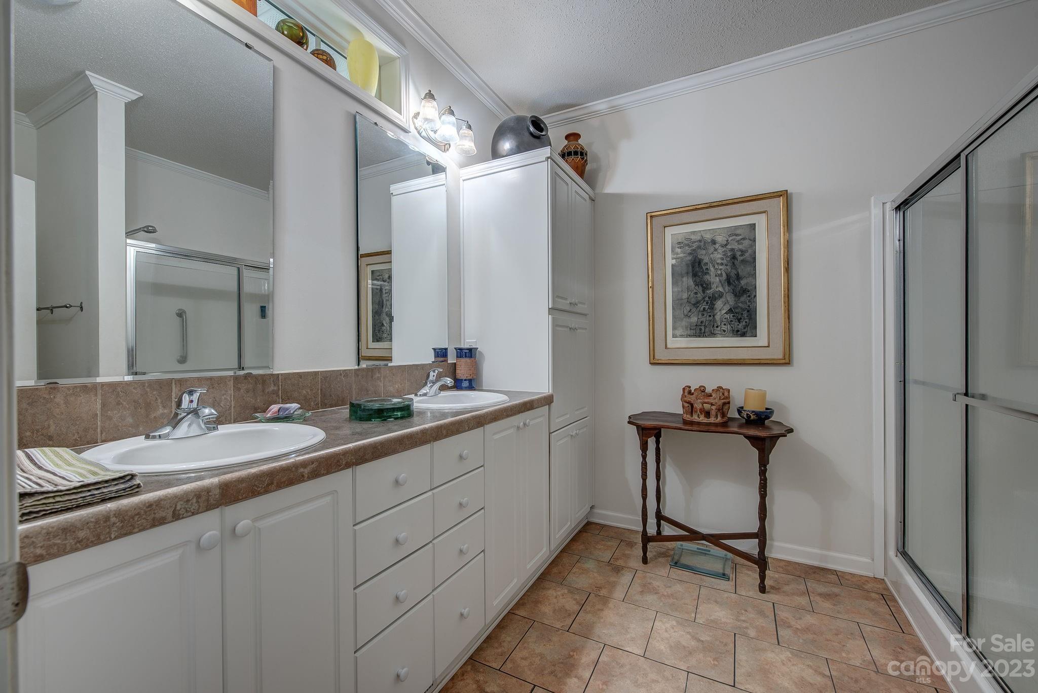 146 Flowers Road Gastonia, NC 28056 - Photo 8 of 11 a en suite bathroom with a toilet sink and mirror