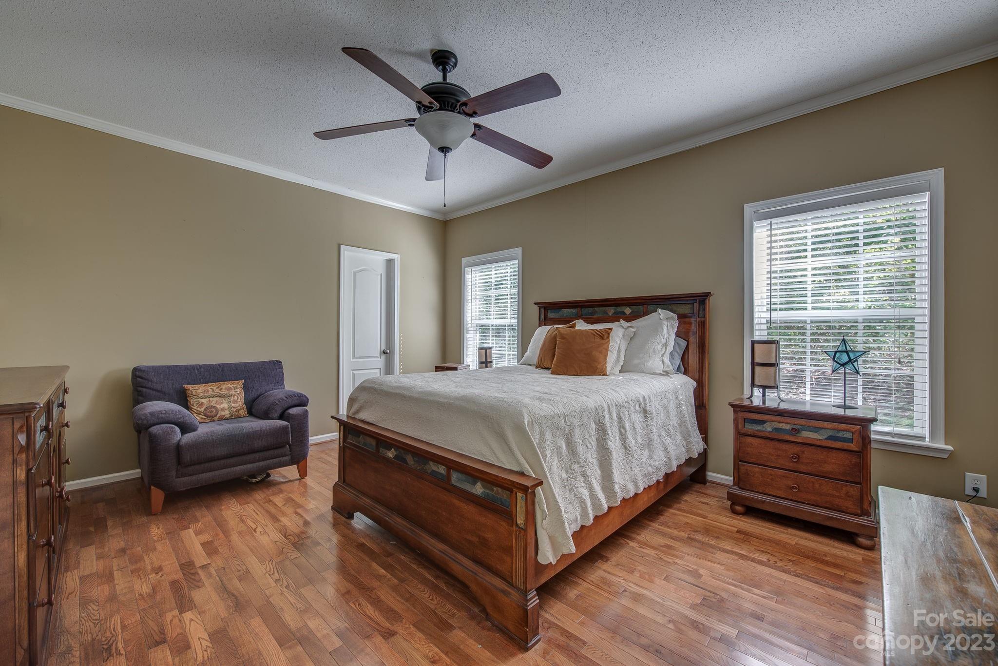 146 Flowers Road Gastonia, NC 28056 - Photo 9 of 11 a bedroom with a bed and a large window