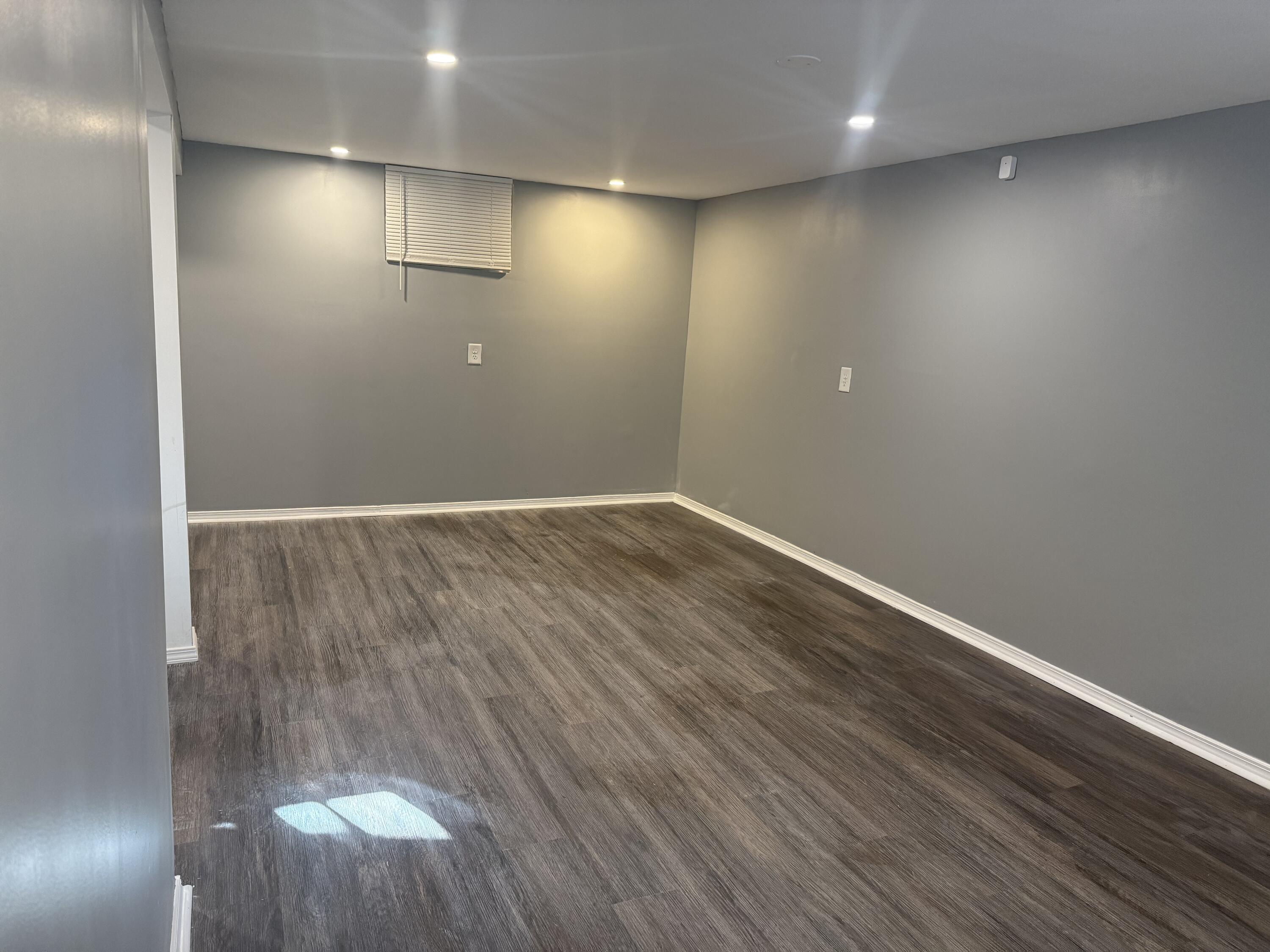 634 Kentucky Street Gary, IN 46402 - Photo 17 of 18 an empty room with wooden floor and windows