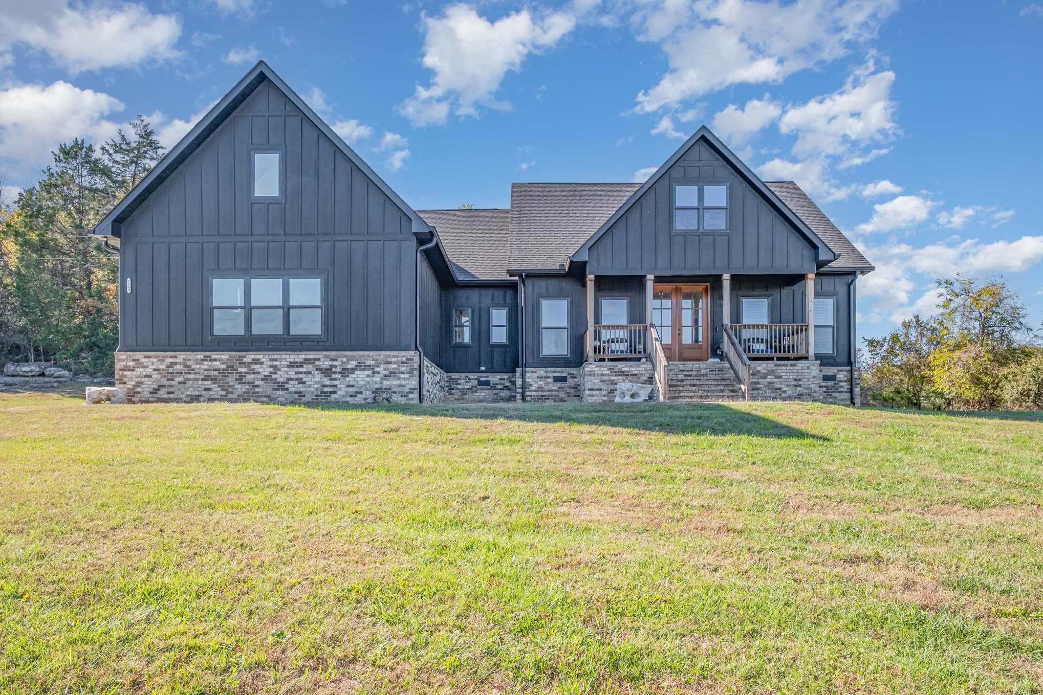 1649 Snake Creek Road Belfast, TN 37019 - Photo 12 of 57 a front view of a house with swimming pool yard and patio