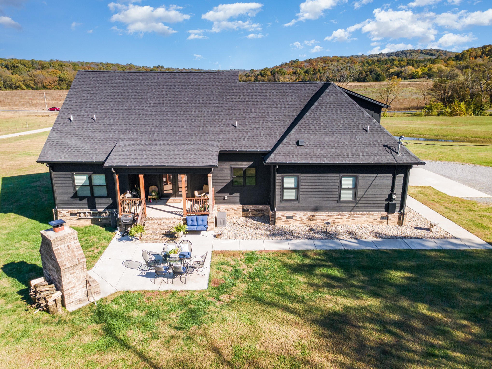 1649 Snake Creek Road Belfast, TN 37019 - Photo 16 of 57 a view of house with backyard outdoor seating and mountain view