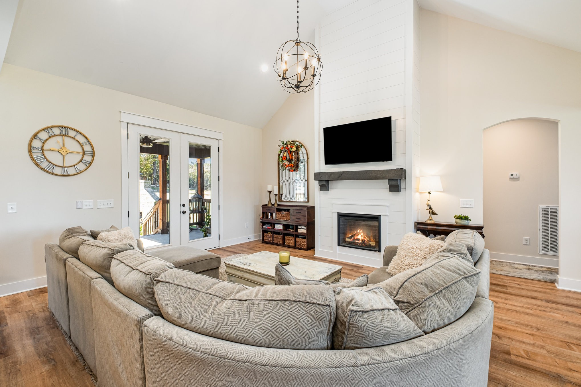 1649 Snake Creek Road Belfast, TN 37019 - Photo 21 of 57 a living room with furniture a fireplace and a flat screen tv
