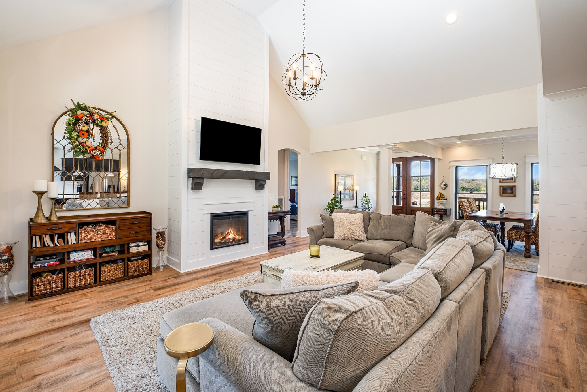 1649 Snake Creek Road Belfast, TN 37019 - Photo 22 of 57 a living room with furniture a flat screen tv and a fireplace