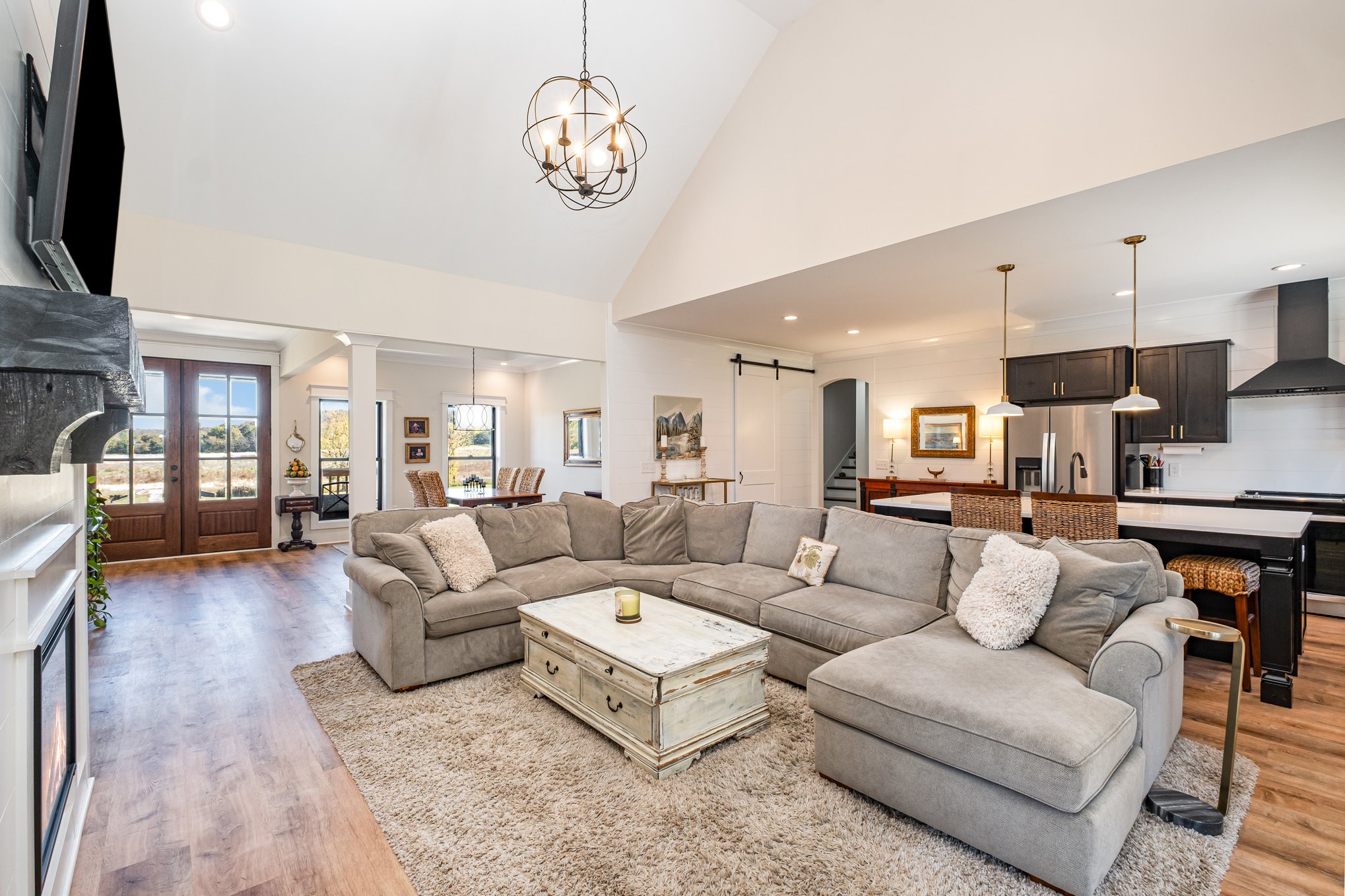 1649 Snake Creek Road Belfast, TN 37019 - Photo 23 of 57 a living room with furniture kitchen view and a flat screen tv