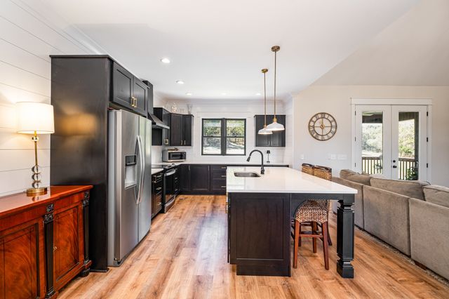 a bedroom with a bed a couch and dresser