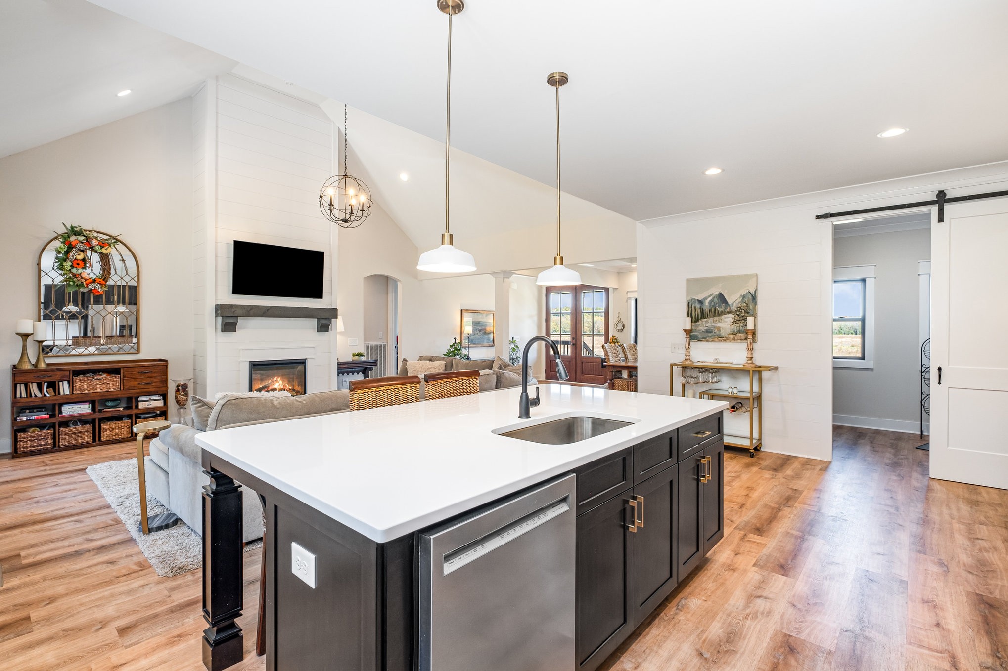 1649 Snake Creek Road Belfast, TN 37019 - Photo 27 of 57 a open kitchen with stainless steel appliances granite countertop a sink a stove and a wooden floor