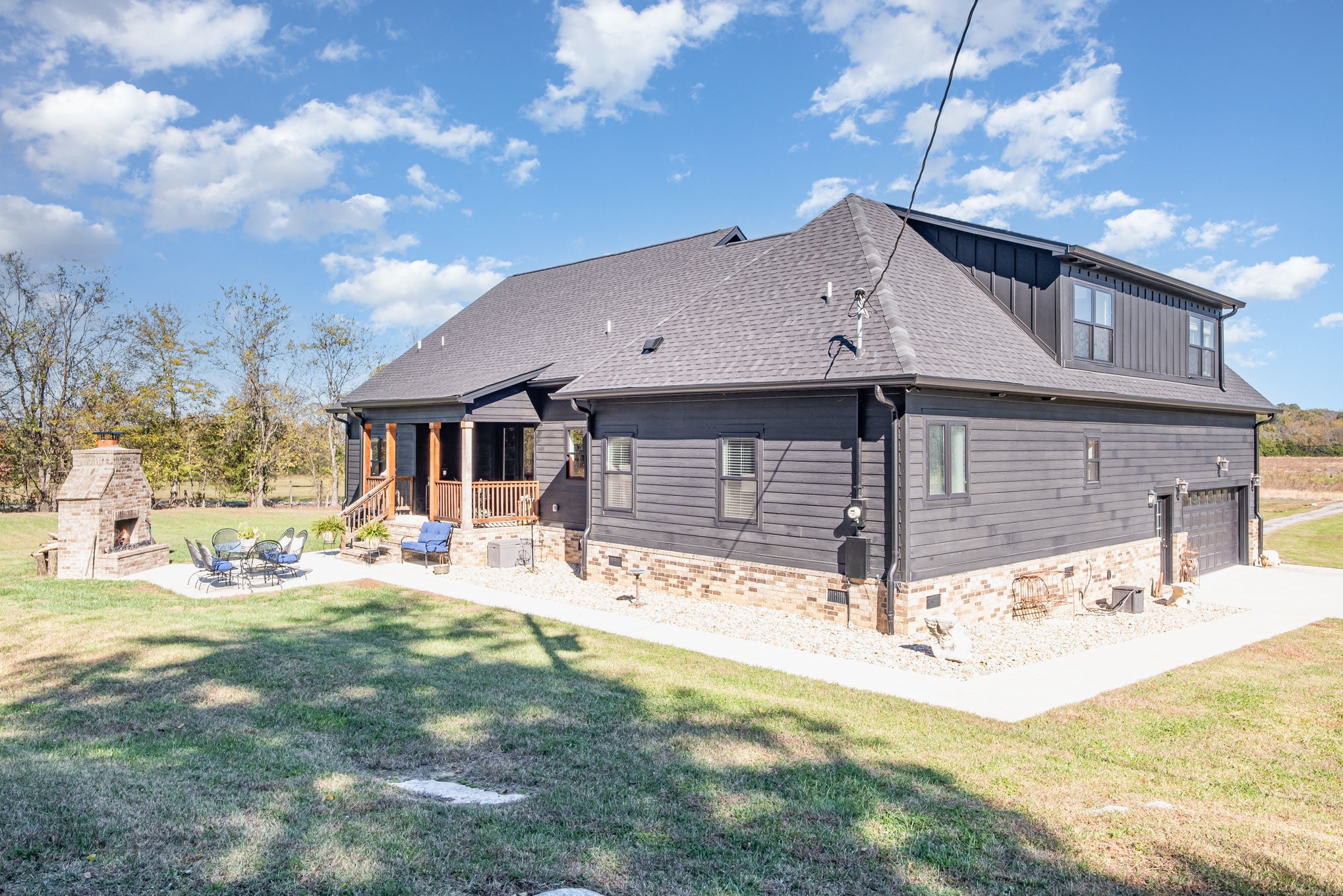 1649 Snake Creek Road Belfast, TN 37019 - Photo 44 of 57 a front view of house with yard outdoor seating and barbeque oven