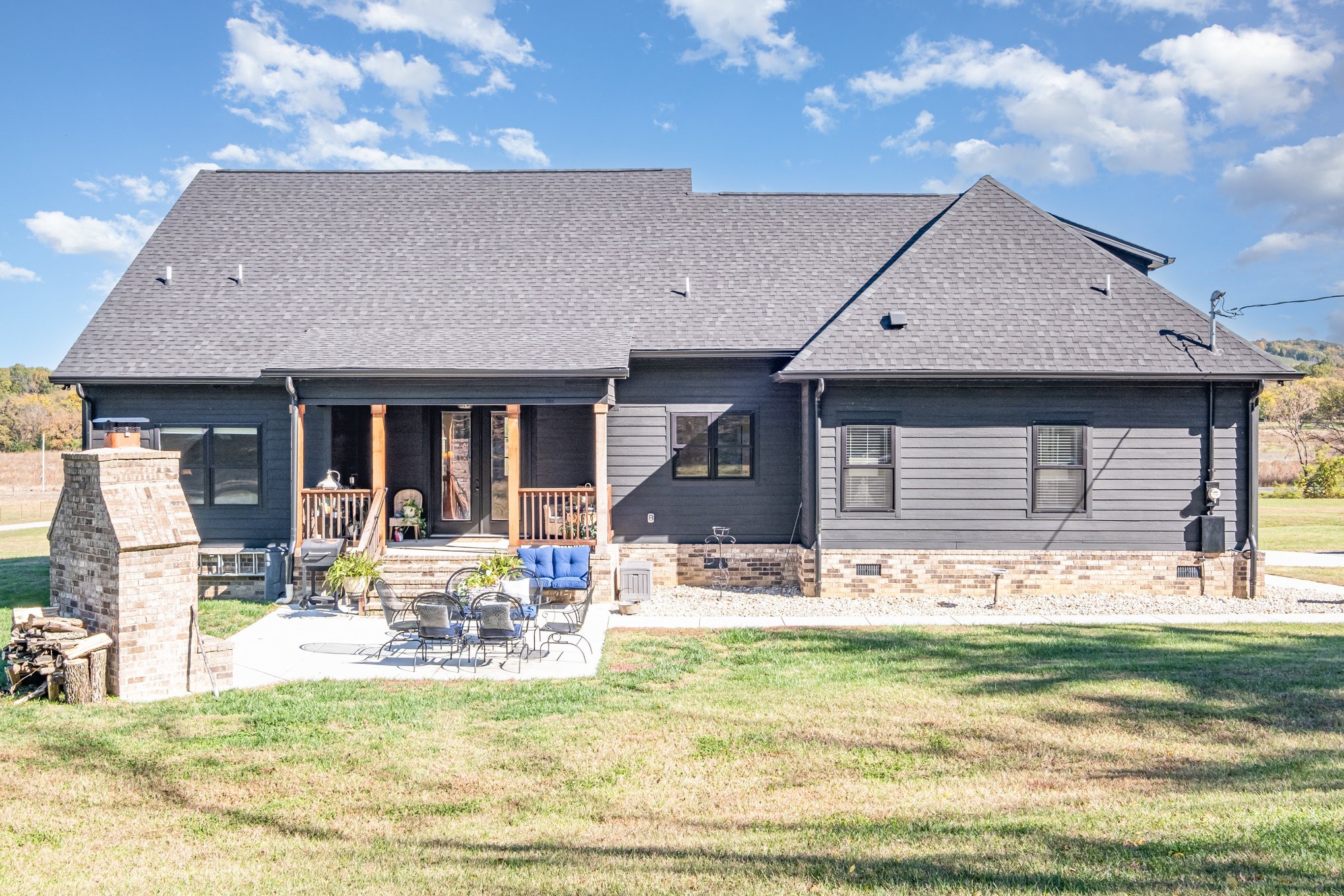 1649 Snake Creek Road Belfast, TN 37019 - Photo 45 of 57 a front view of a house with swimming pool and porch with furniture