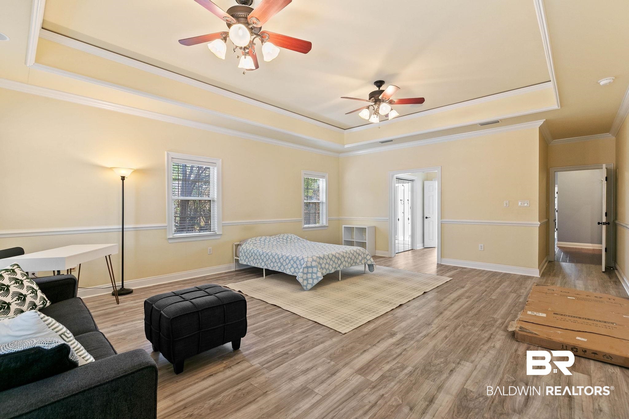 3668 Claridge Road North Mobile, AL 36608 - Photo 51 of 100 Bedroom with a tray ceiling, light wood-type flooring, ceiling fan, and ornamental molding