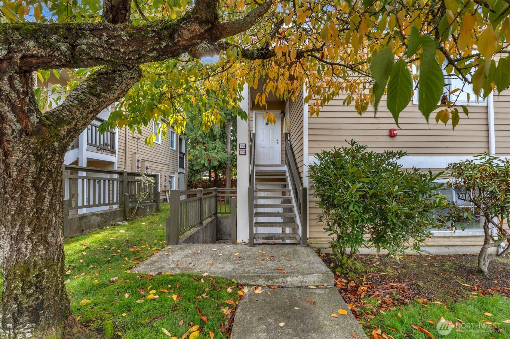 5300 Harbour Pointe Boulevard, Unit 307A Mukilteo, WA 98275 - Photo 1 of 25 a front view of a house with a yard and tree s