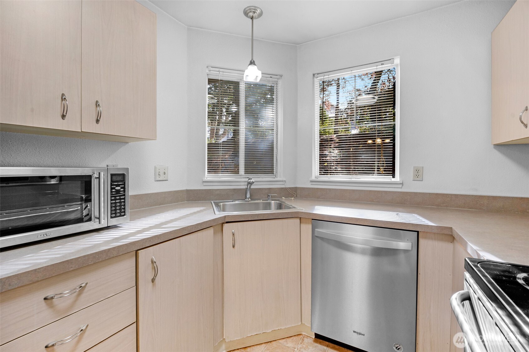5300 Harbour Pointe Boulevard, Unit 307A Mukilteo, WA 98275 - Photo 11 of 25 a kitchen with granite countertop stainless steel appliances a sink stove and cabinets