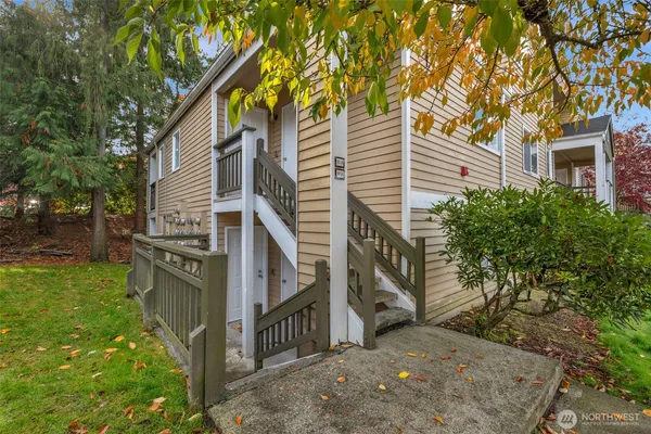 a view of a house with a tree
