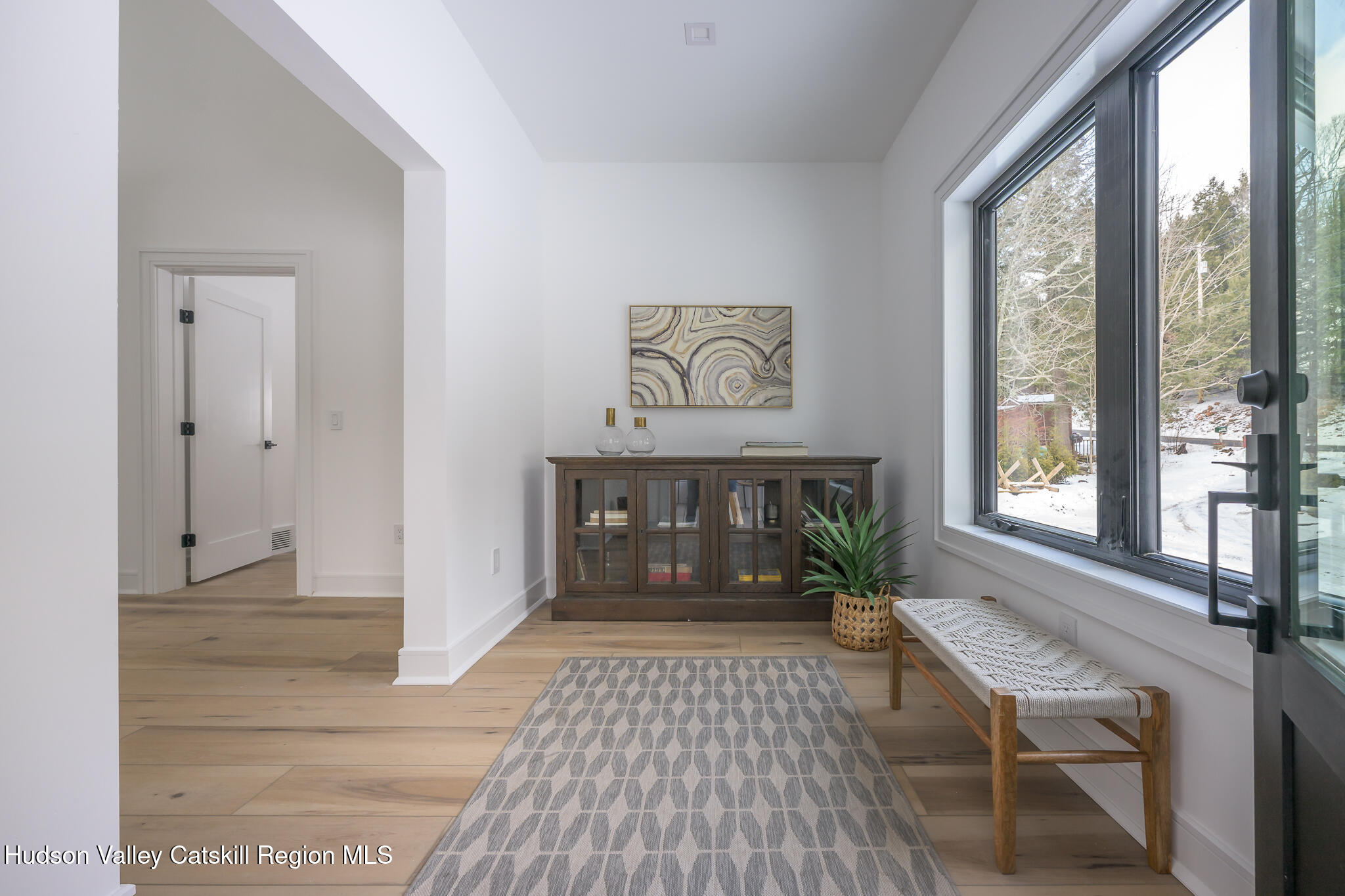305 Mitchell Hollow Road Windham, NY 12496 - Photo 5 of 39 a living room with furniture and a fireplace
