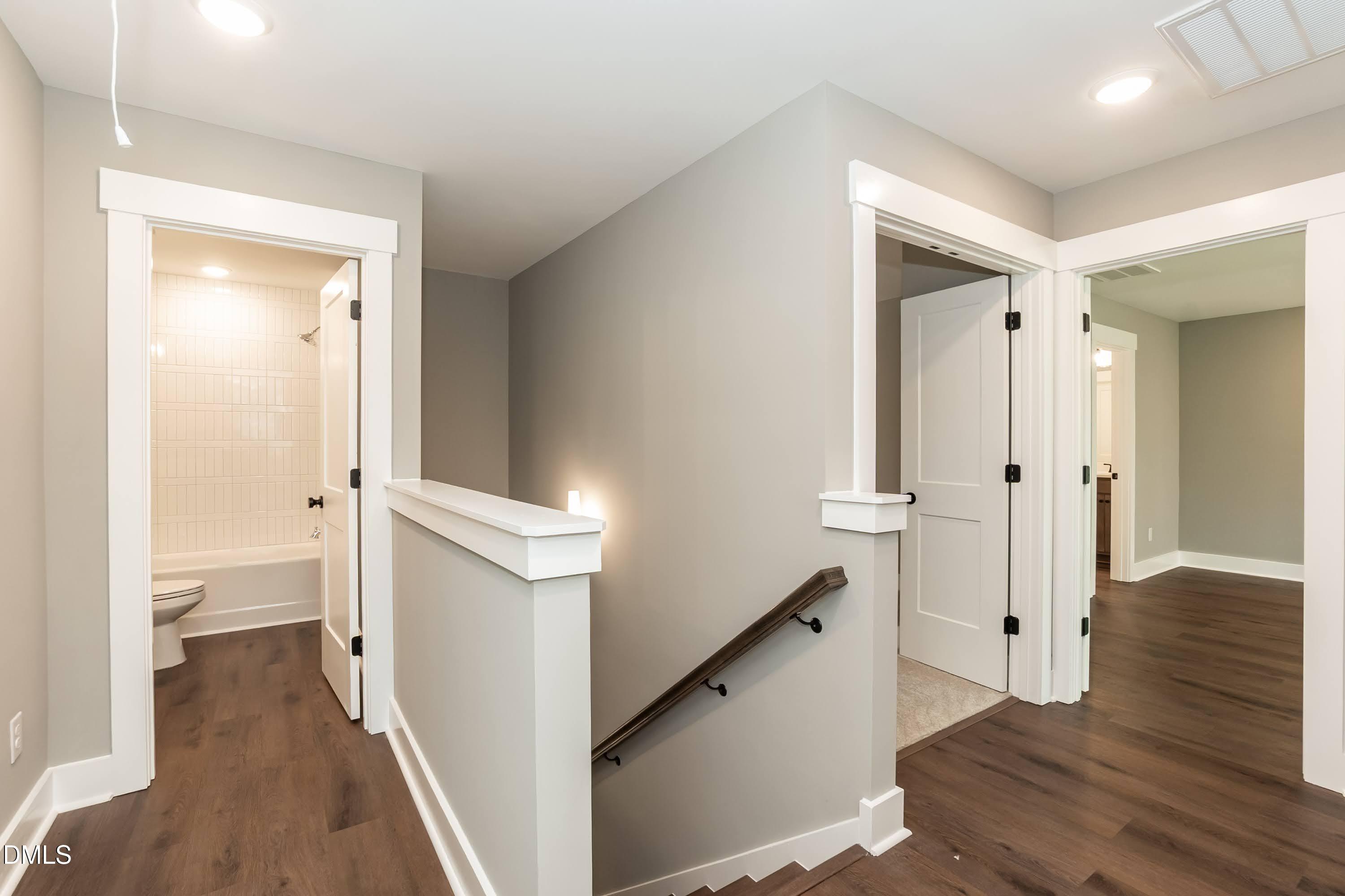 104 Buffalo Drive Spring Hope, NC 27882 - Photo 20 of 48 a view of a hallway with wooden floor and staircase
