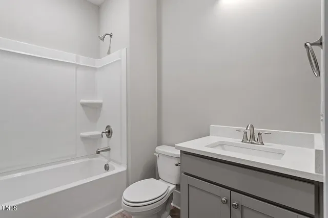 a bathroom with a sink a toilet and bathtub