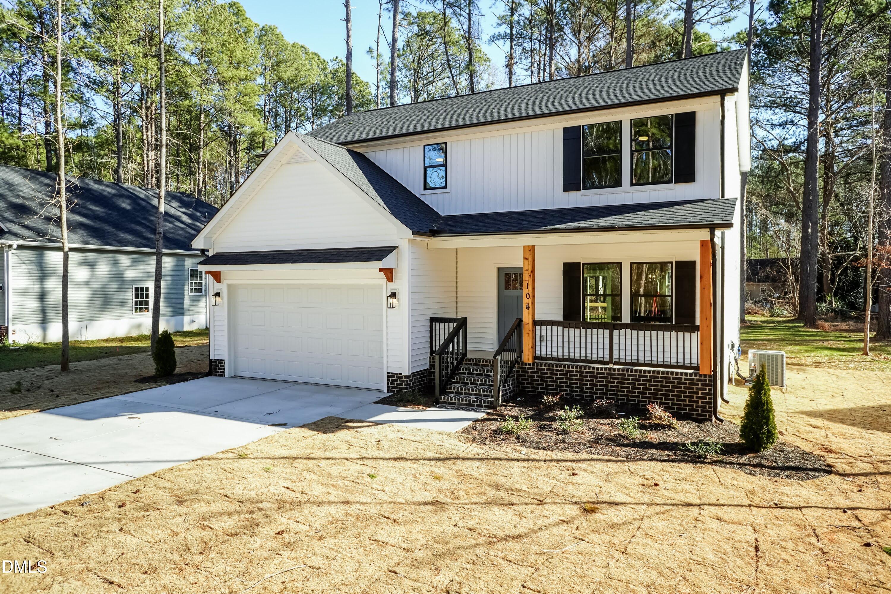 104 Buffalo Drive Spring Hope, NC 27882 - Photo 2 of 48 a front view of a house with a yard