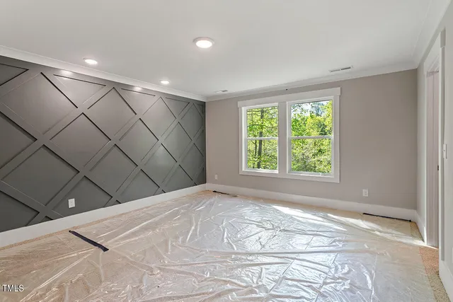 a view of a livingroom with a dishwasher and a large window