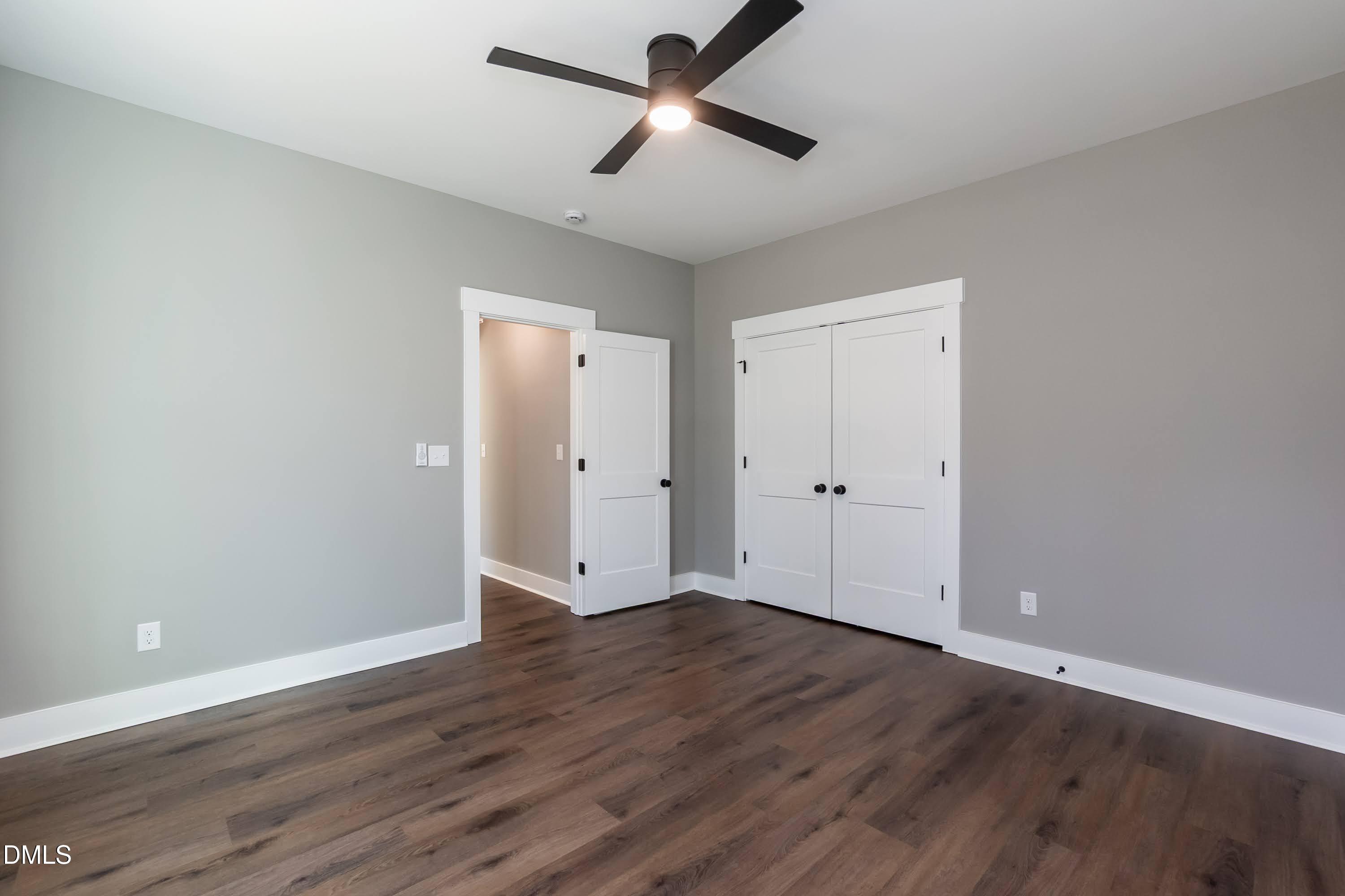 104 Buffalo Drive Spring Hope, NC 27882 - Photo 28 of 48 a view of room with hardwood floor and a ceiling fan