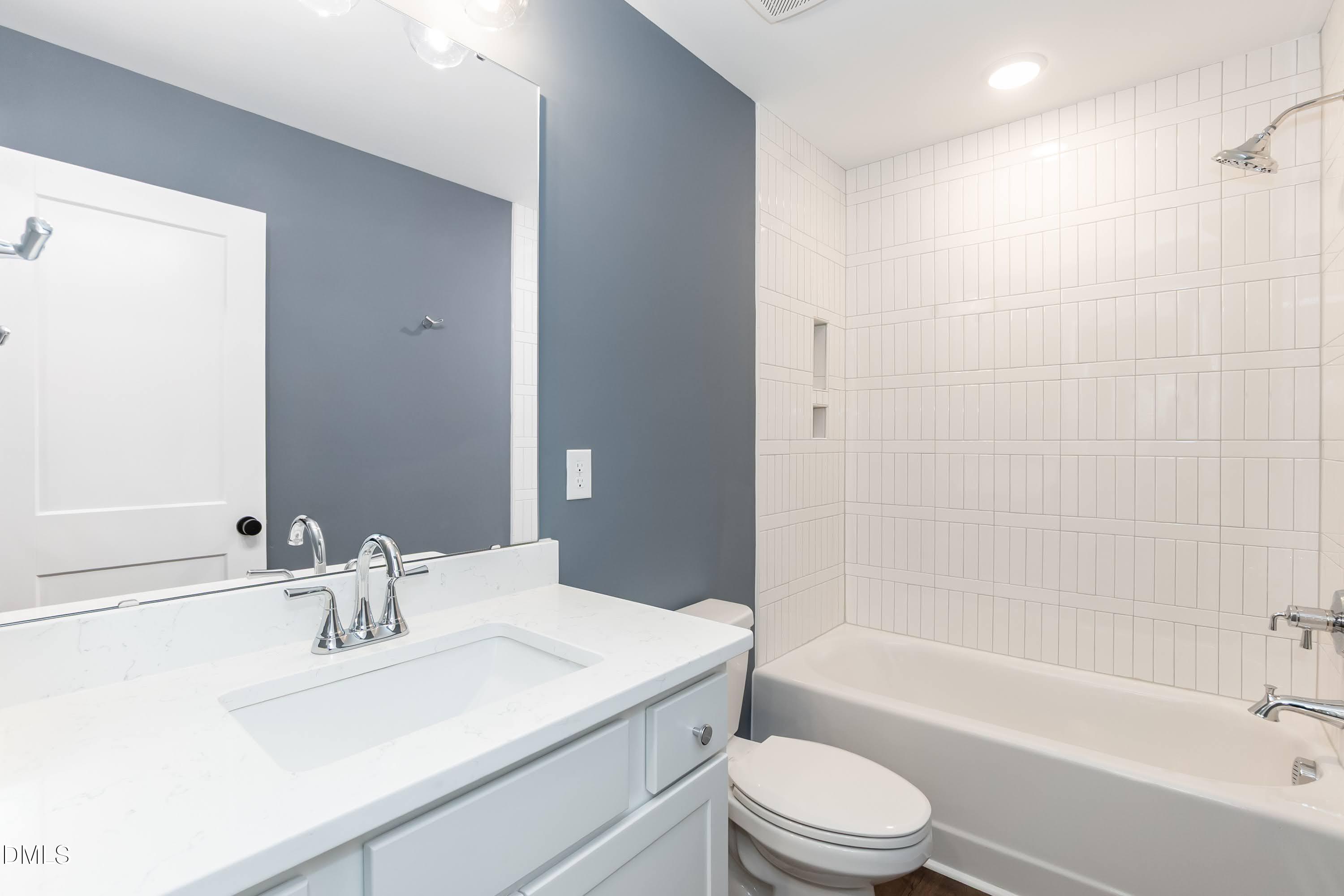 104 Buffalo Drive Spring Hope, NC 27882 - Photo 31 of 48 a bathroom with a sink a toilet and a bathtub