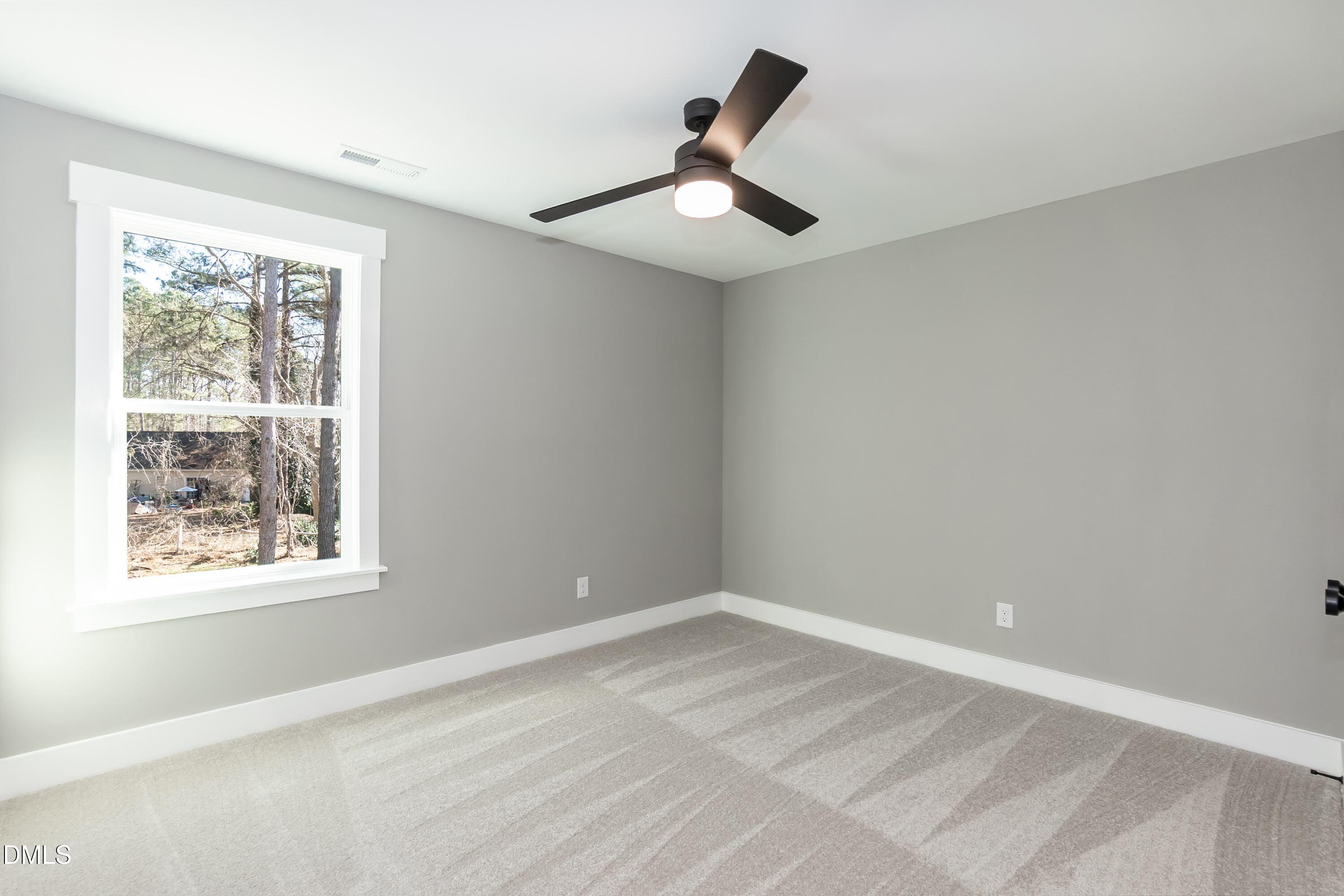 104 Buffalo Drive Spring Hope, NC 27882 - Photo 32 of 48 a view of an empty room with a window